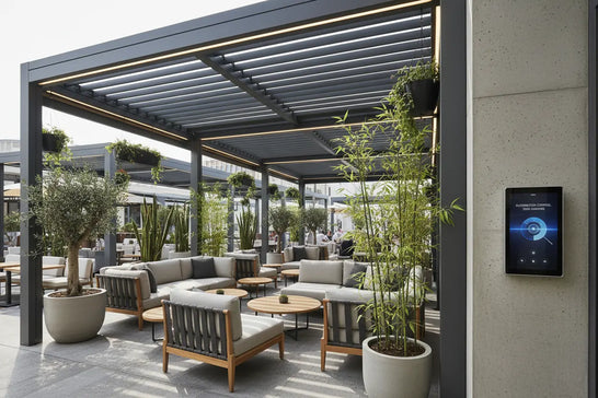 Modern luxury outdoor dining space with smart aluminum louvered pergola showcasing 2026 commercial shading trends - automated systems, sustainable design, and biophilic hospitality architecture